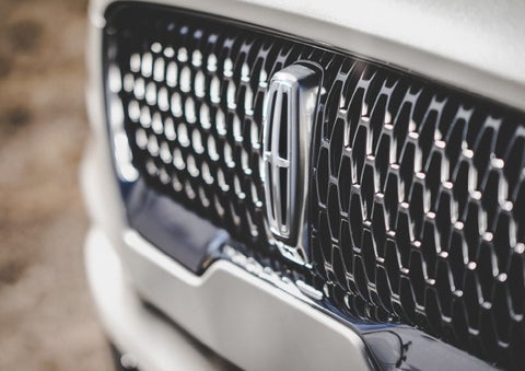 The grille of the 2024 Lincoln Aviator® Reserve model with an eye-catching repeated field of Lincoln Star logo shapes | Nick Mayer Lincoln Mayfield in Mayfield Heights OH