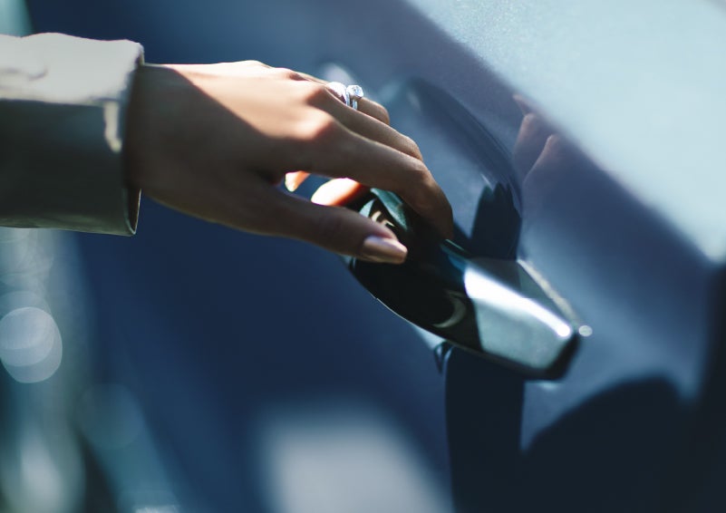 A hand gracefully grips the Light Touch Handle of a 2024 Lincoln Aviator® SUV to demonstrate its ease of use | Nick Mayer Lincoln Mayfield in Mayfield Heights OH