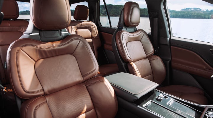 The front row's Perfect Position Seats in a 2024 Lincoln Aviator® Reserve model with Ebony Roast interior | Nick Mayer Lincoln Mayfield in Mayfield Heights OH