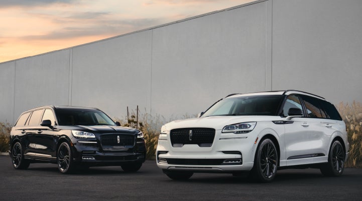 Two Lincoln Aviator® SUVs are shown with the available Jet Appearance Package | Nick Mayer Lincoln Mayfield in Mayfield Heights OH