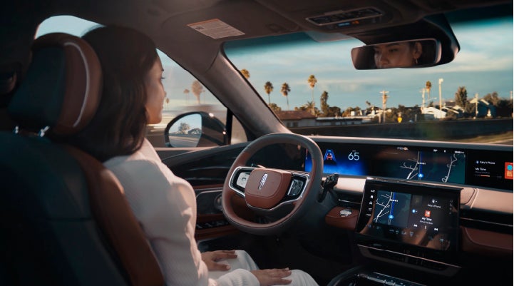 A person is shown driving hands-free on the highway with available Lincoln BlueCruise technology. | Nick Mayer Lincoln Mayfield in Mayfield Heights OH