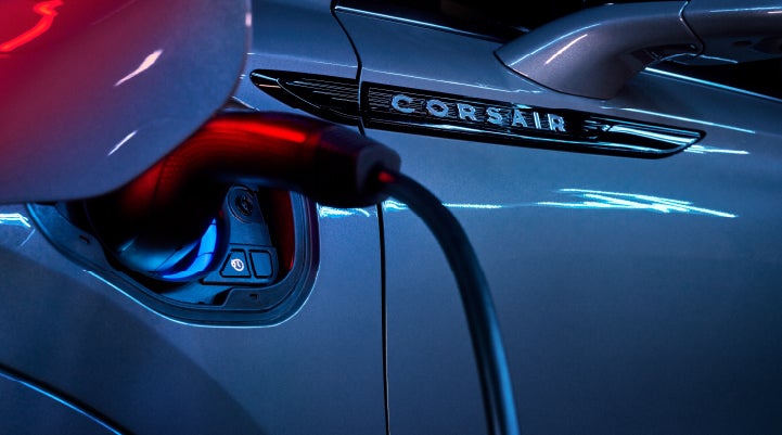 A charger plugged into the charging port of a 2024 Lincoln Corsair® Plug-in Hybrid model. | Nick Mayer Lincoln Mayfield in Mayfield Heights OH