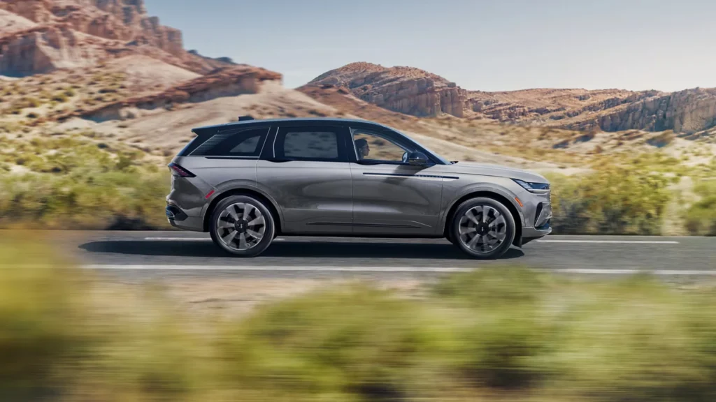 Gray 2025 Lincoln Nautilus® Reserve captured in side view on a desert highway.