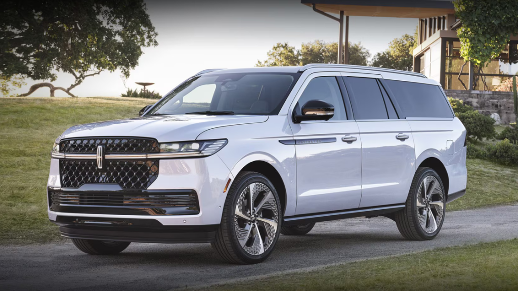 2025 Lincoln Black Label Navigator SUV in white parked in front of modern luxury home exterior
