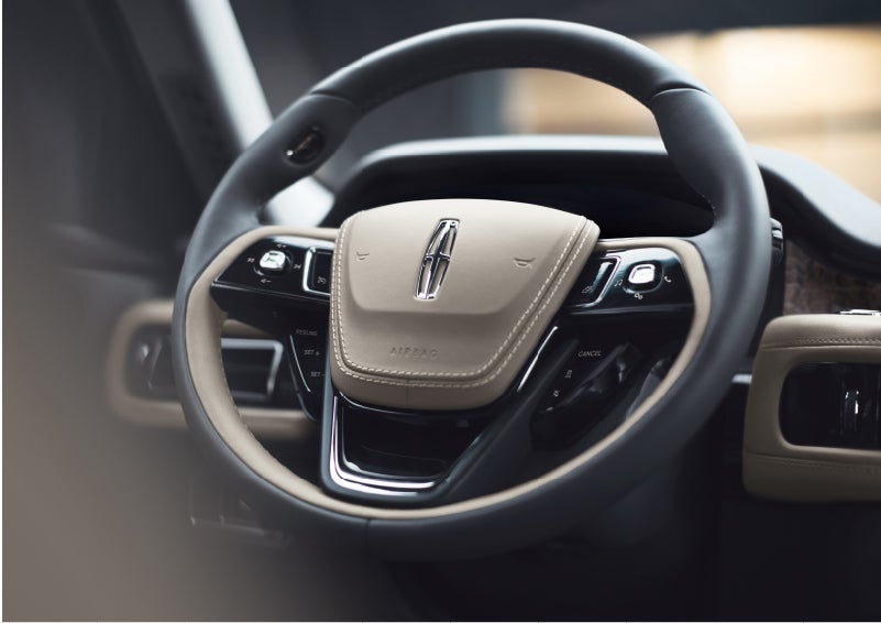 The intuitively placed controls of the steering wheel on a 2023 Lincoln Aviator® SUV | Nick Mayer Lincoln Mayfield in Mayfield Heights OH