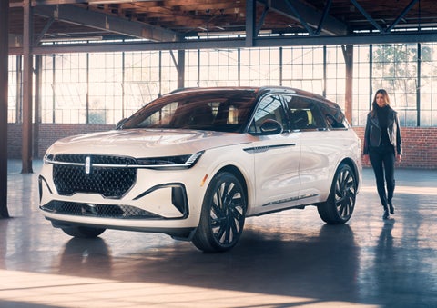 A person approaches a 2024 Lincoln Nautilus® SUV. | Nick Mayer Lincoln Mayfield in Mayfield Heights OH