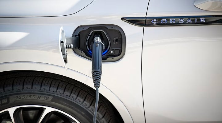 An electric charger is shown plugged into the charging port of a Lincoln Corsair® Grand Touring
model. | Nick Mayer Lincoln Mayfield in Mayfield Heights OH