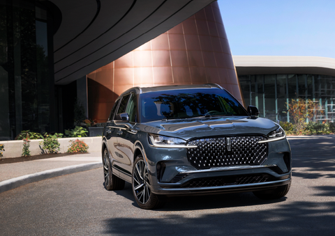 A gray 2025 Lincoln Aviator® SUV is parked outside a modern building with the sun shining. | Nick Mayer Lincoln Mayfield in Mayfield Heights OH