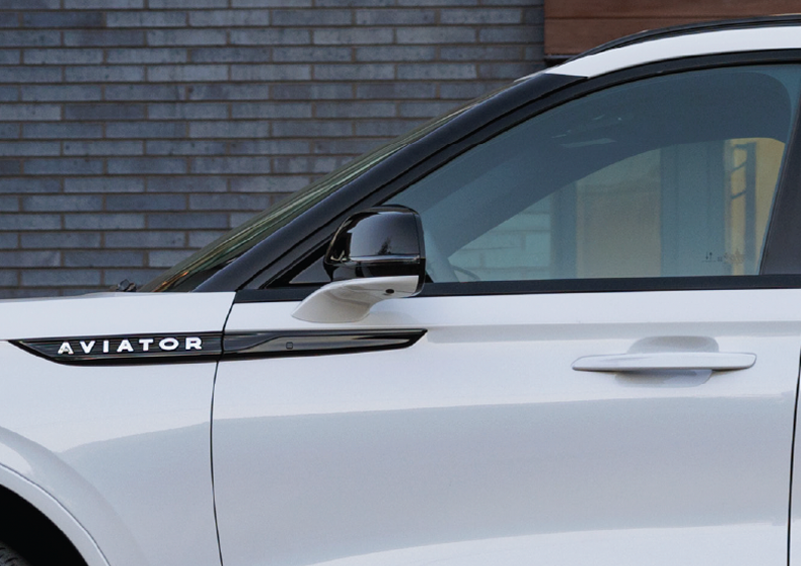 The driver’s door of a white 2025 Lincoln Aviator® SUV is showcased. | Nick Mayer Lincoln Mayfield in Mayfield Heights OH