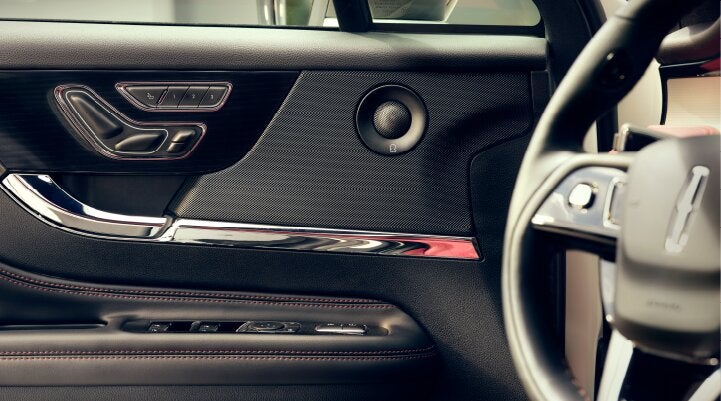 A Revel® audio speaker is shown in the driver's side door of a 2025 Lincoln Corsair® SUV. | Nick Mayer Lincoln Mayfield in Mayfield Heights OH