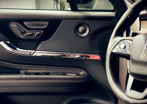 The driver of a 2024 Lincoln Corsair® SUV is shown selecting the drive mode. | Nick Mayer Lincoln Mayfield in Mayfield Heights OH