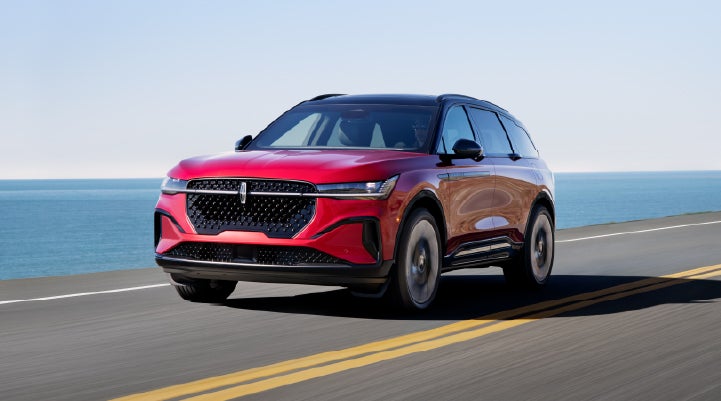 A 2025 Lincoln Nautilus® SUV is being driven on a seaside roadway. | Nick Mayer Lincoln Mayfield in Mayfield Heights OH