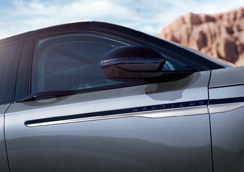 Blue lettering on the side of the vehicle that reads nautilus indicates the available hybrid powertrain. | Nick Mayer Lincoln Mayfield in Mayfield Heights OH