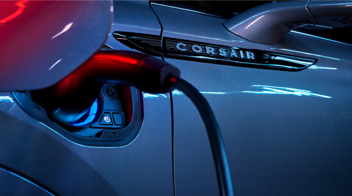 A charger plugged into the charging port of a 2025 Lincoln Corsair® Plug-in Hybrid model. | Nick Mayer Lincoln Mayfield in Mayfield Heights OH