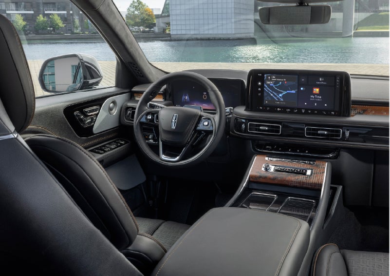 The interior of the 2026 Lincoln Aviator® SUV is shown parked with a view of a harbor through the windshield. | Nick Mayer Lincoln Mayfield in Mayfield Heights OH