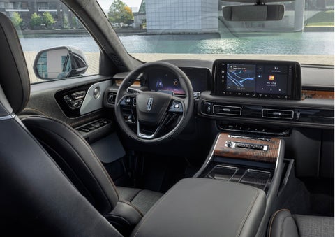 The interior of the 2026 Lincoln Aviator® SUV is shown parked with a view of a harbor through the windshield. | Nick Mayer Lincoln Mayfield in Mayfield Heights OH