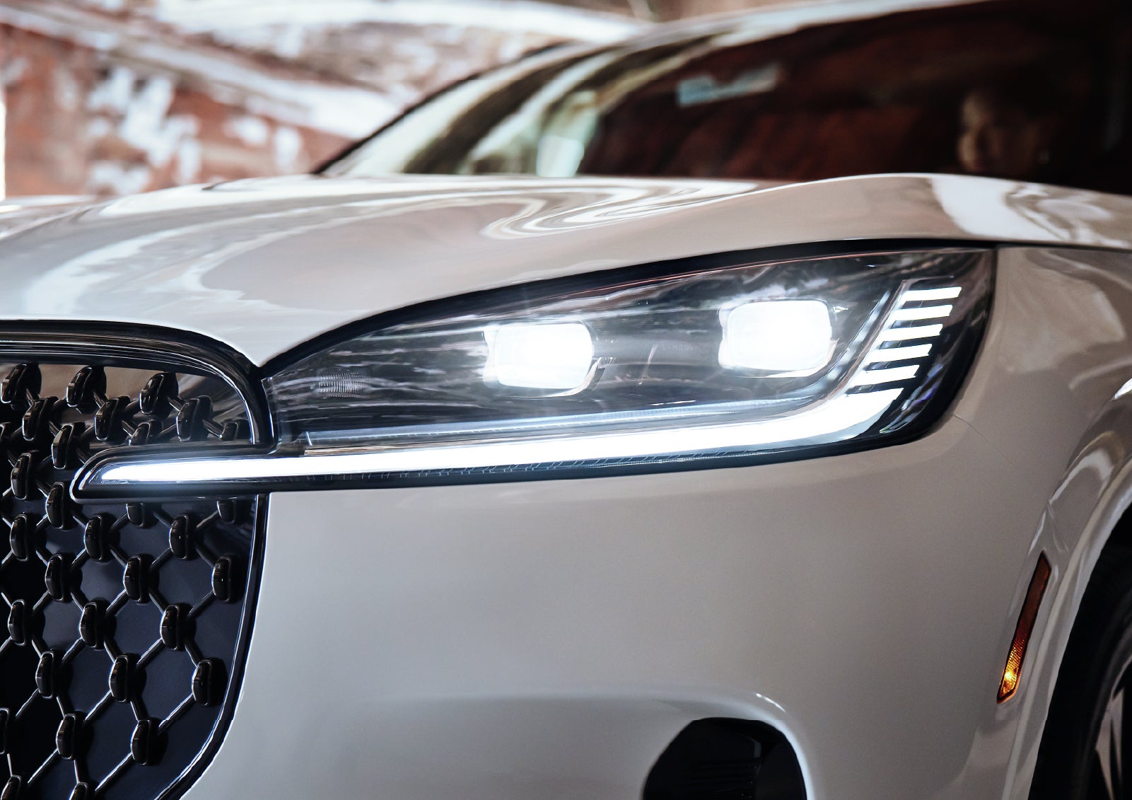 A close-up of a headlamp on the 2027 Lincoln Aviator® SUV is shown. | Nick Mayer Lincoln Mayfield in Mayfield Heights OH