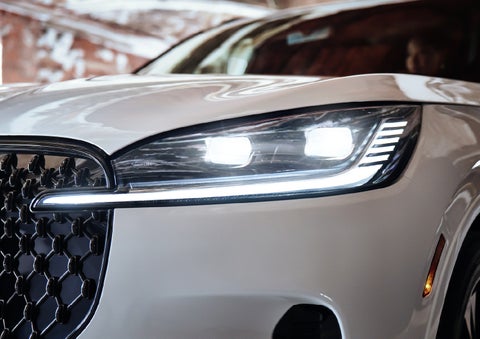 A close-up of a headlamp on the 2027 Lincoln Aviator® SUV is shown. | Nick Mayer Lincoln Mayfield in Mayfield Heights OH