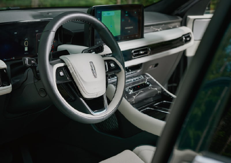 The leather-trimmed steering wheel of a 2027 Lincoln Aviator® Black Label™ SUV. | Nick Mayer Lincoln Mayfield in Mayfield Heights OH