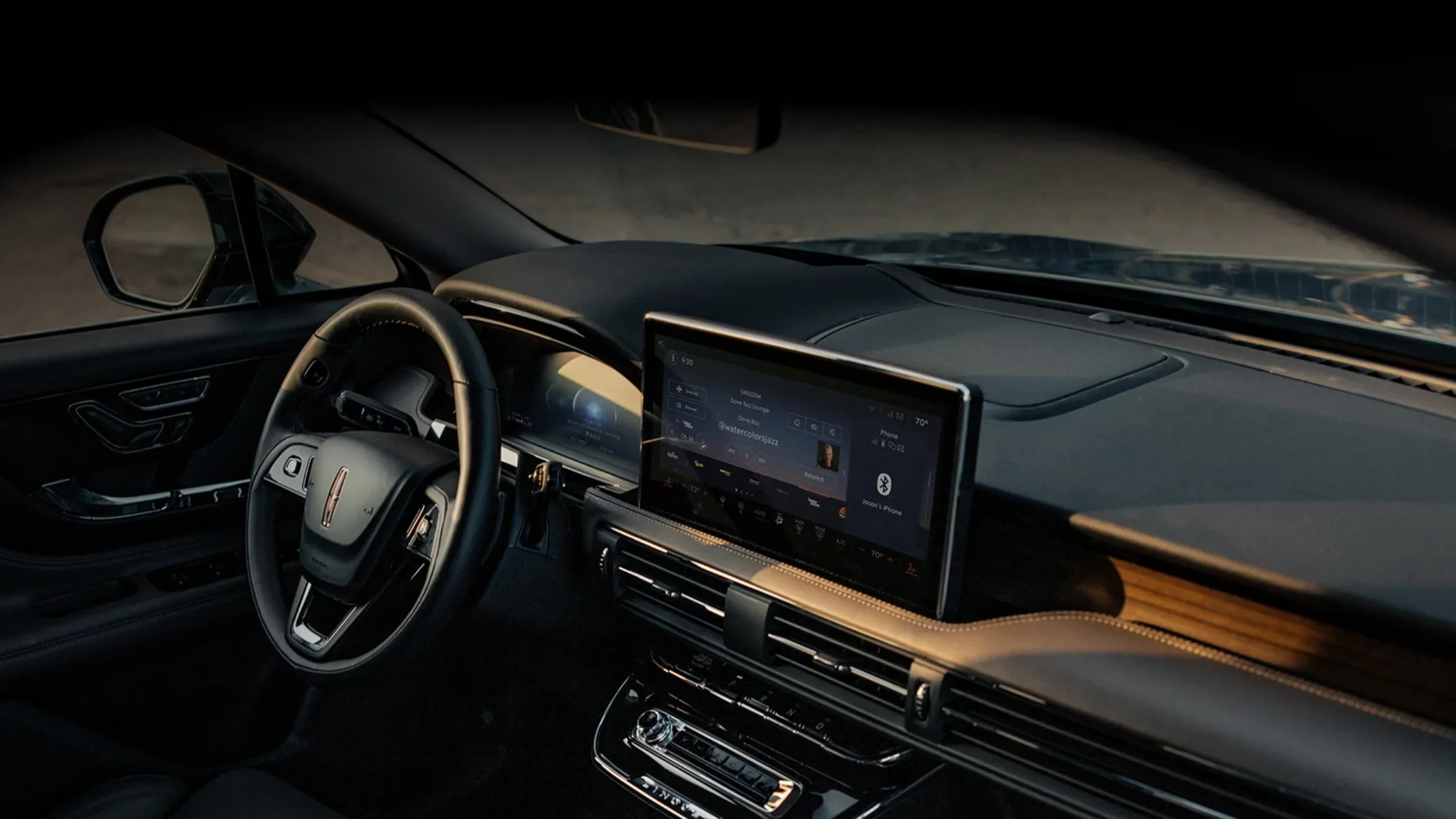 2025 Lincoln Corsair Grand Touring interior with leather seats, digital display, and wood-trimmed dashboard.