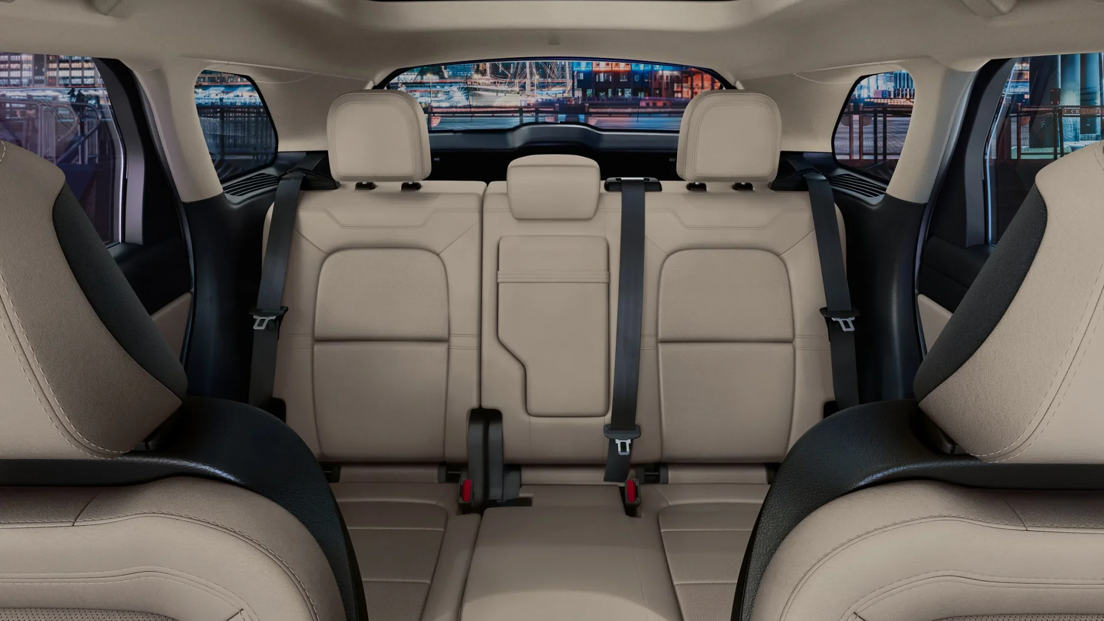 Rear cabin view of 2025 Lincoln Corsair Reserve with beige leather seats and black accents.