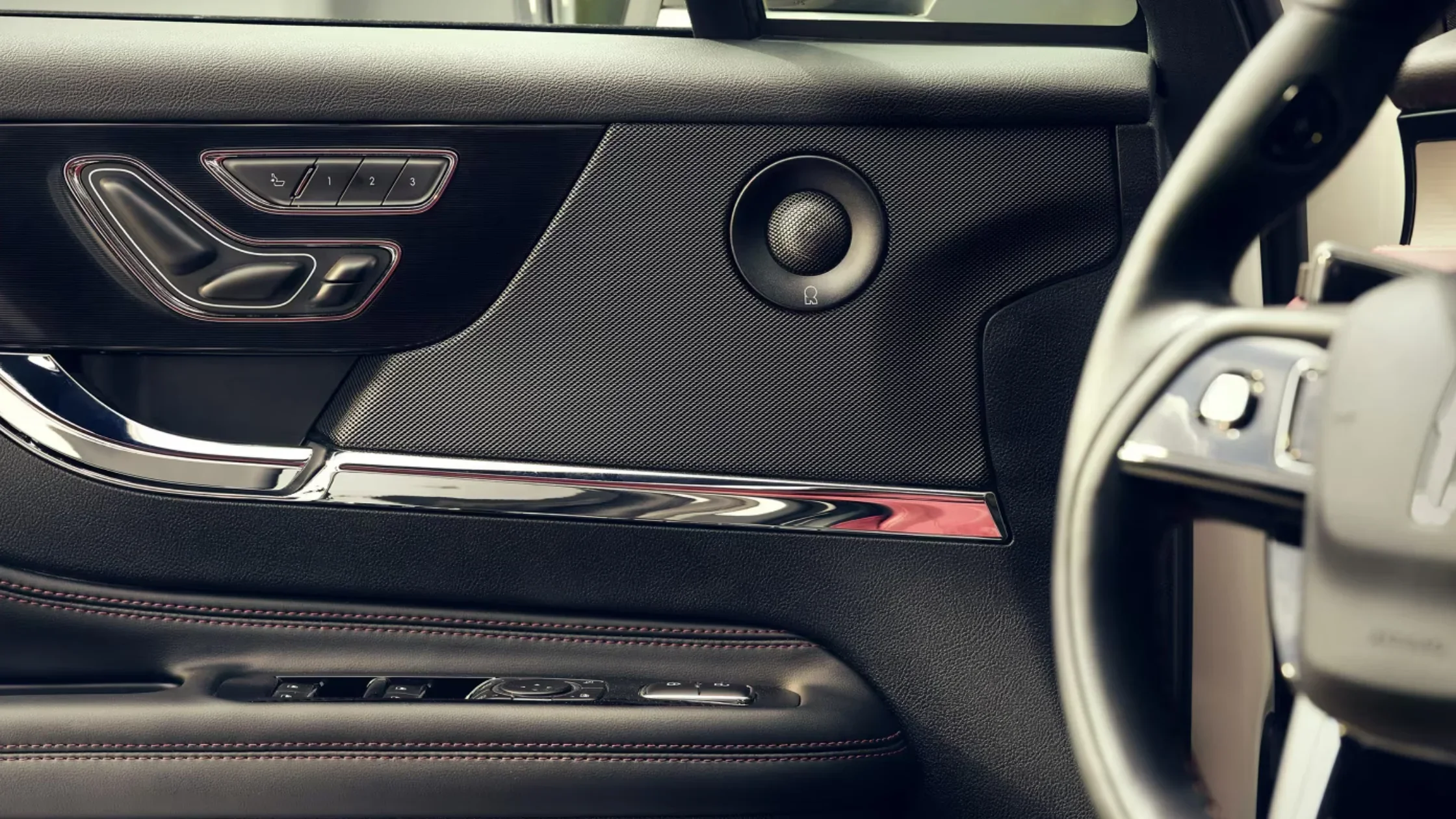 2025 Corsair® Reserve exterior driving along city waterfront with refined compact SUV design.