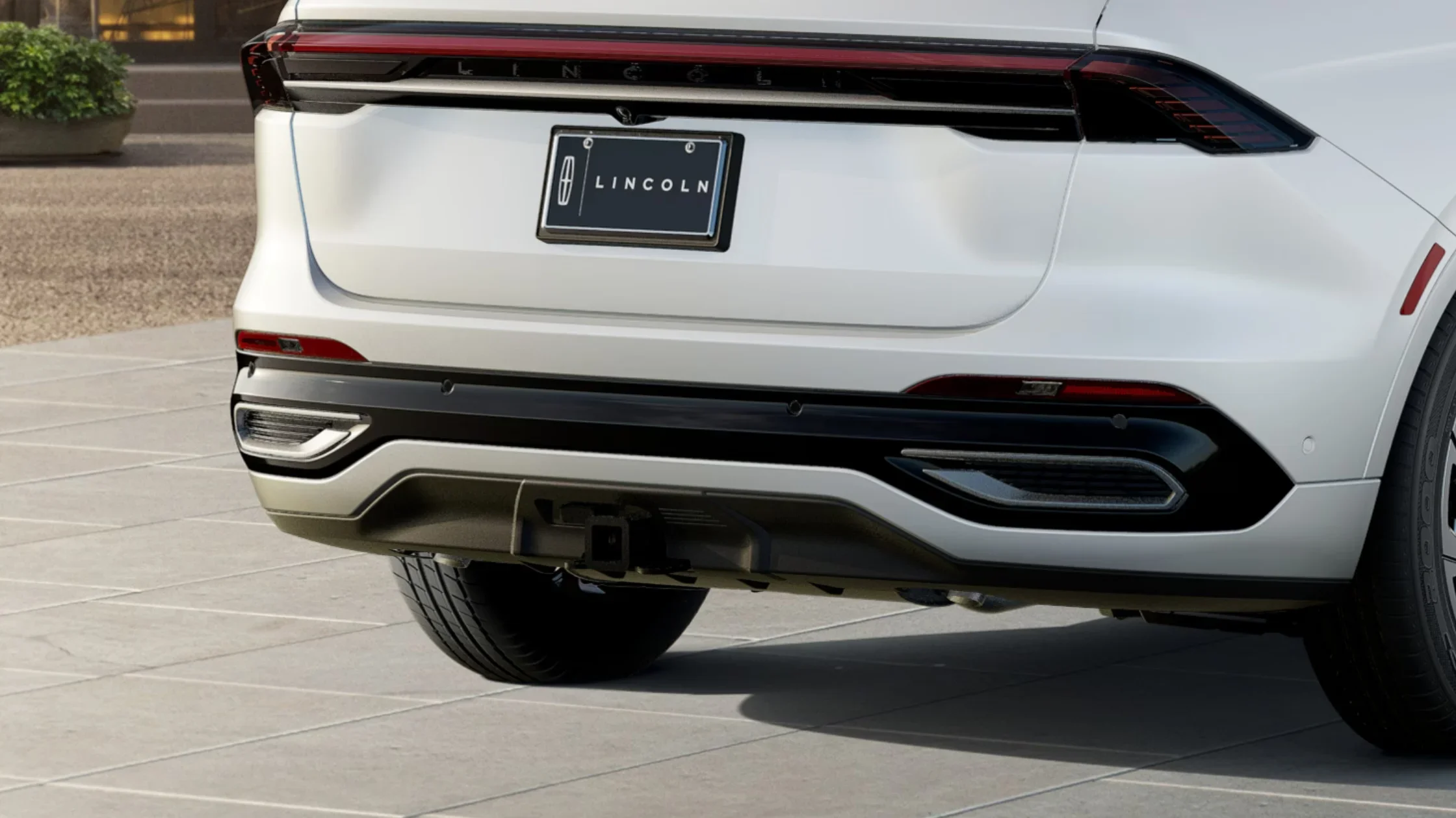 Rear view of the 2025 Lincoln Black Label Nautilus showing LED taillights and tow hitch detail.