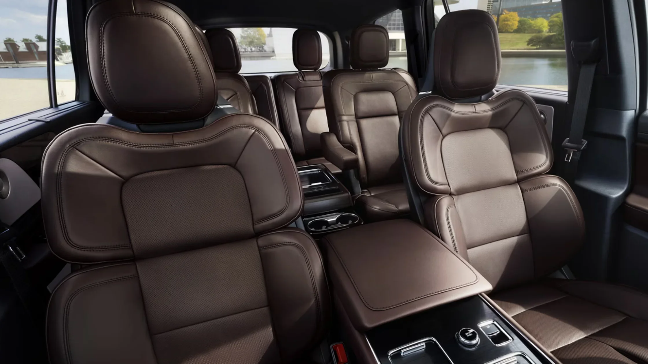 Interior view of the 2025 Lincoln Aviator® Reserve showing brown leather captain's chairs