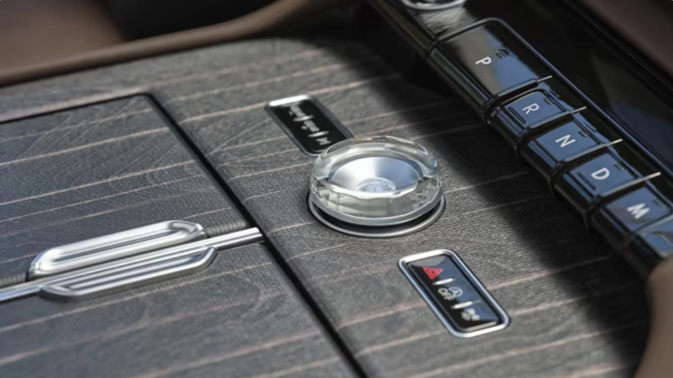2025 Black Label Navigator center console with rotary dial, drive buttons and wood-pattern trim.