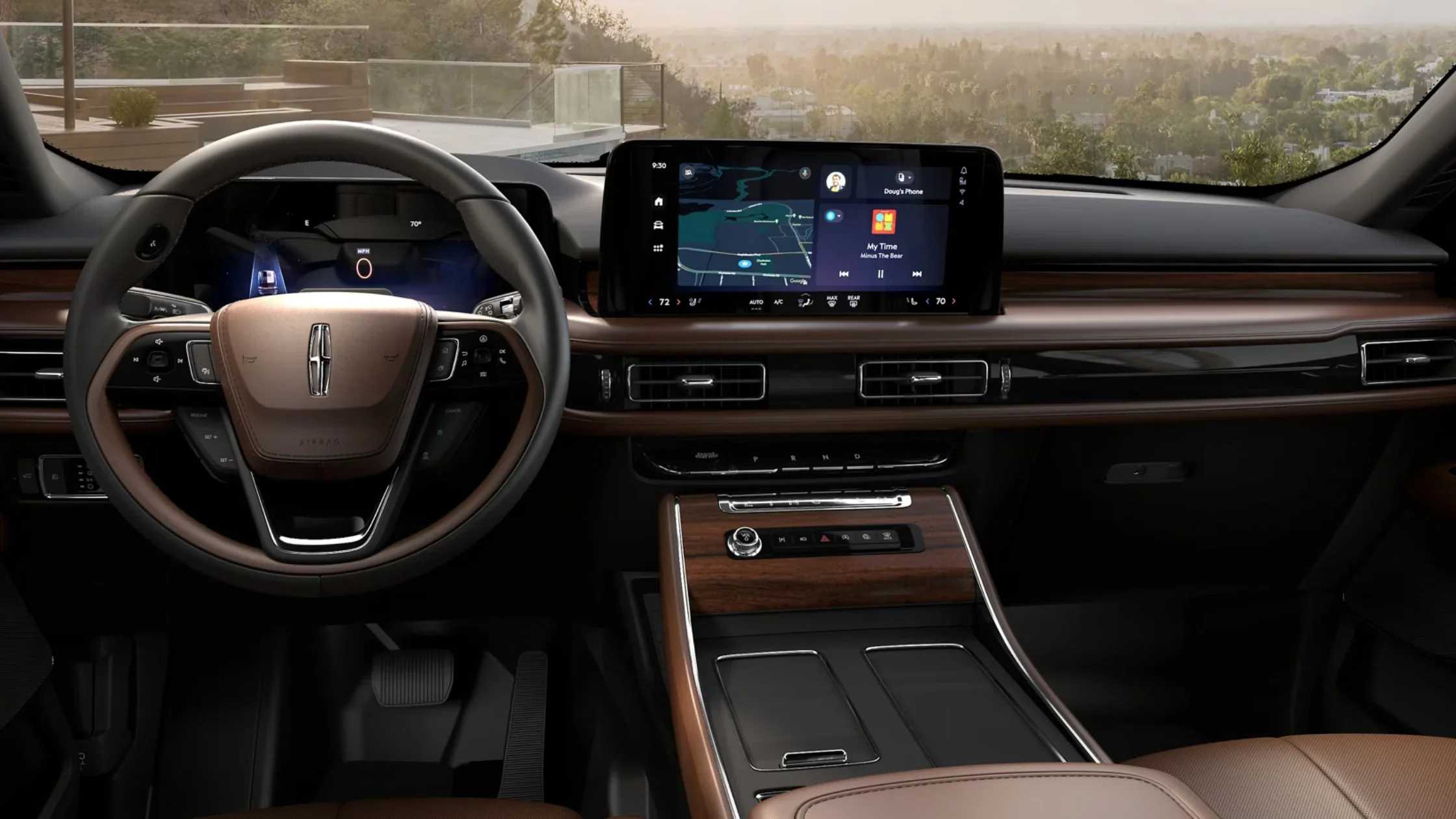 Interior of the 2025 Lincoln Aviator Reserve showcasing wood-trimmed dashboard and touchscreen display.