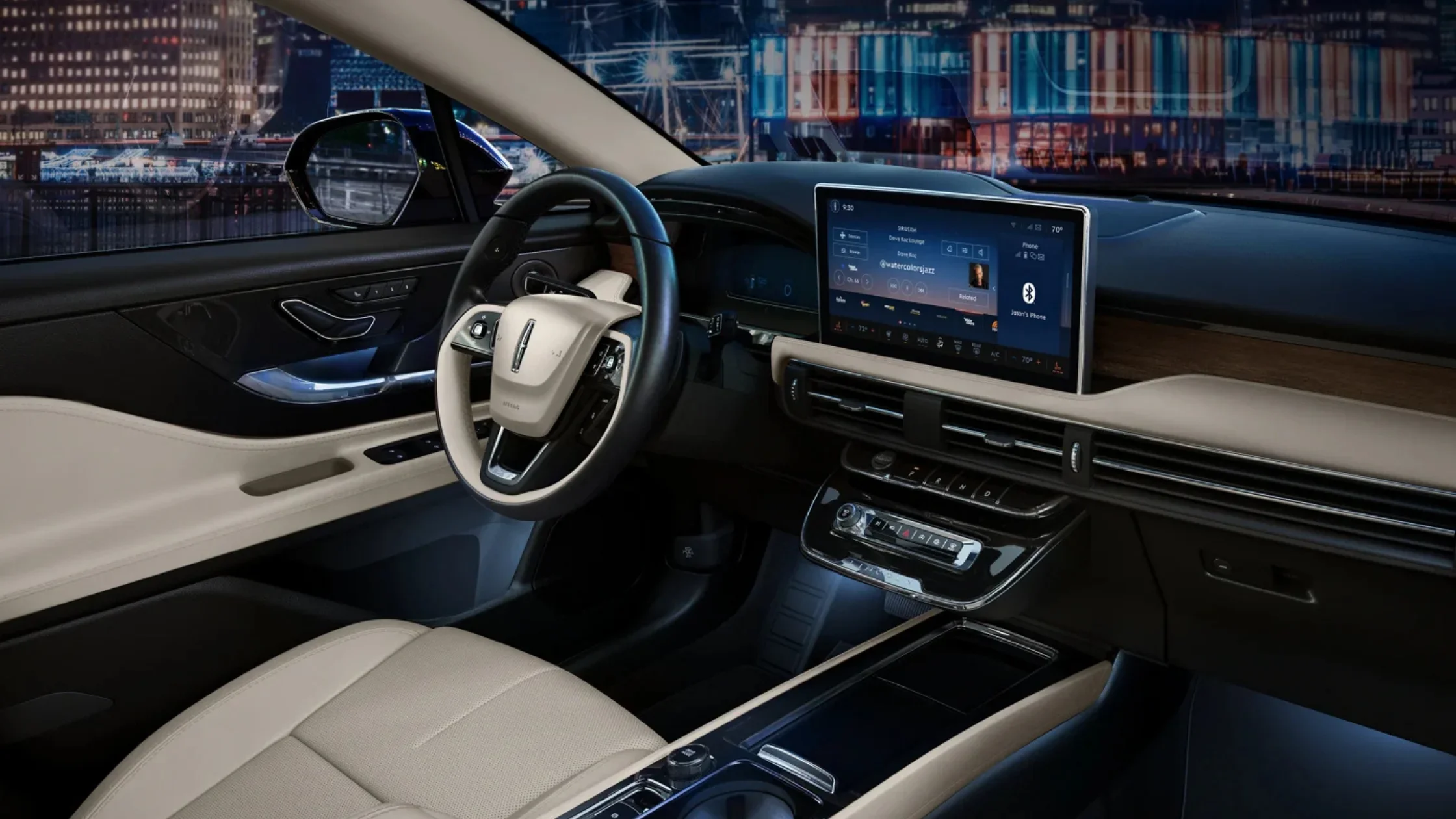 2025 Corsair® Grand Touring beige leather interior with digital touchscreen display.